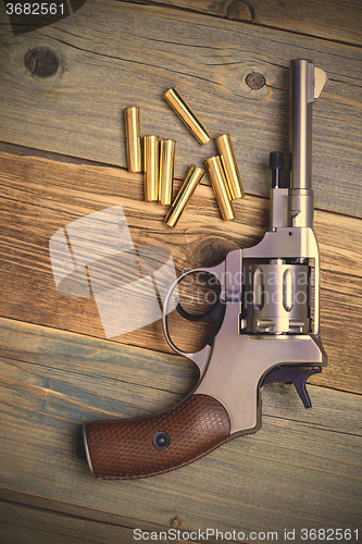 Image of Vintage revolver nagant with seven cartridges