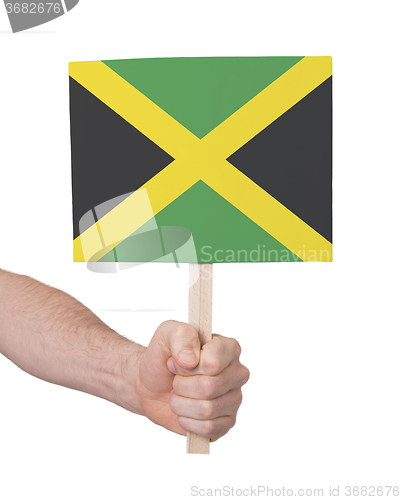 Image of Hand holding small card - Flag of Jamaica