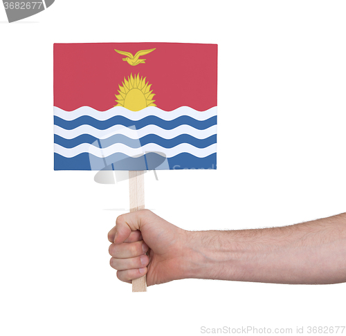 Image of Hand holding small card - Flag of Kiribati