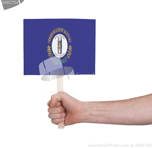 Image of Hand holding small card - Flag of Kentucky