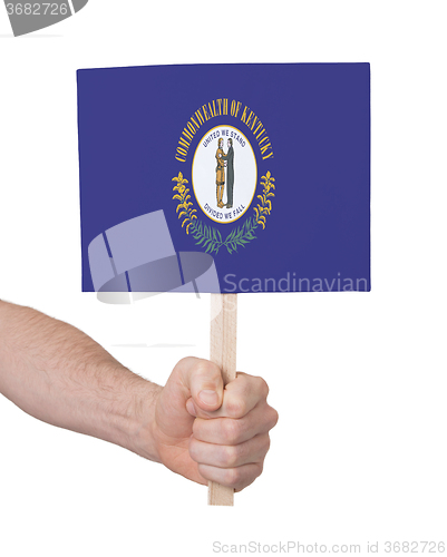 Image of Hand holding small card - Flag of Kentucky