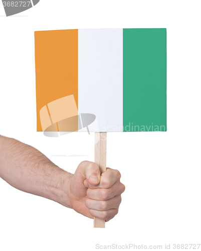 Image of Hand holding small card - Flag of Ivory Coast