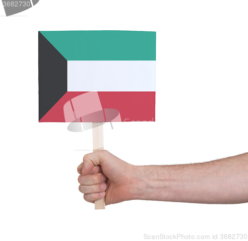 Image of Hand holding small card - Flag of Kuwait