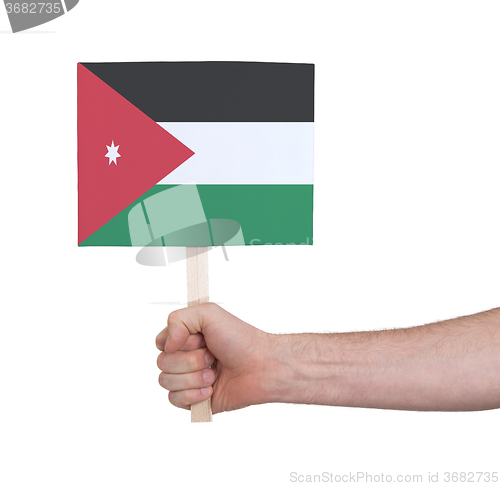 Image of Hand holding small card - Flag of Jordan