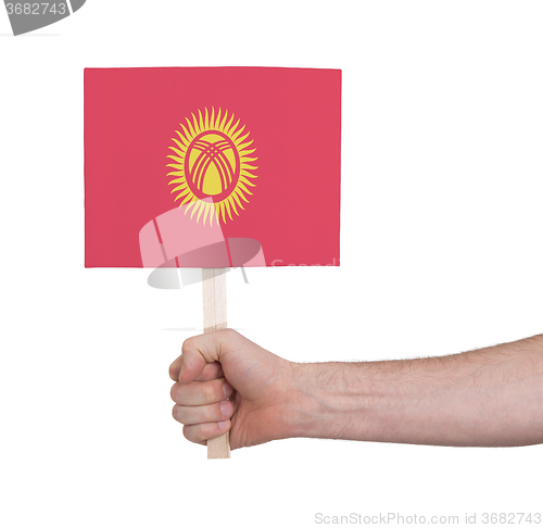 Image of Hand holding small card - Flag of Kyrgyzstan