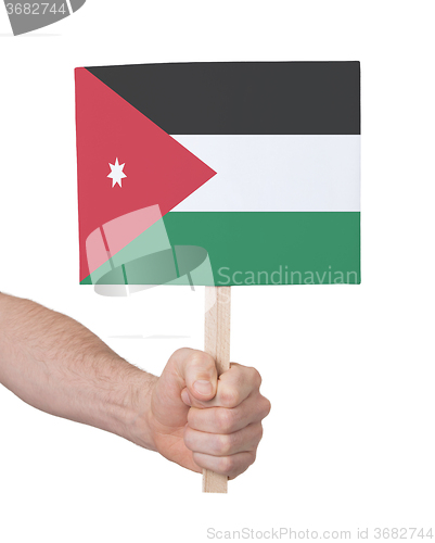 Image of Hand holding small card - Flag of Jordan