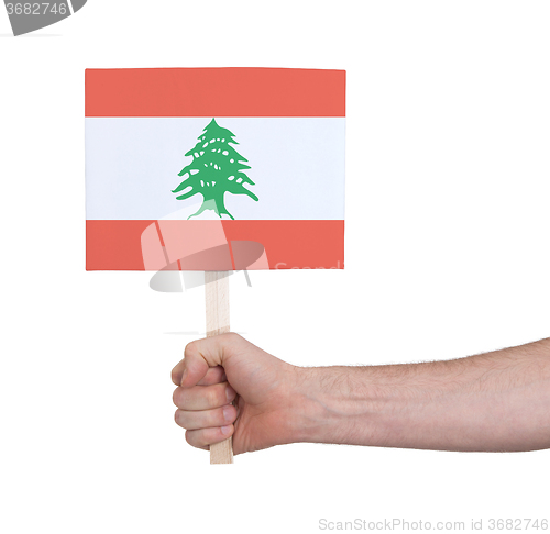 Image of Hand holding small card - Flag of Lebanon