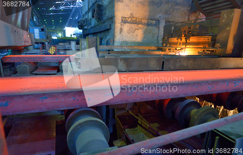 Image of hot steel on conveyor