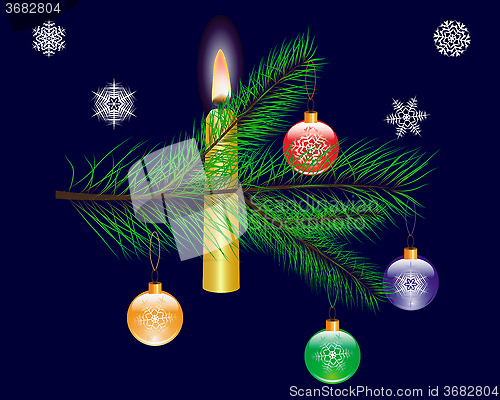 Image of Christmas toy on a branch of tree