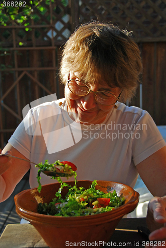 Image of Eating senior woman