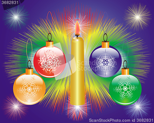 Image of new year's toys and burning candle