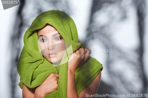 Image of Woman with smokey makeup and green turban