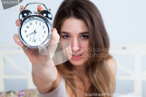 Image of The young girl in bed