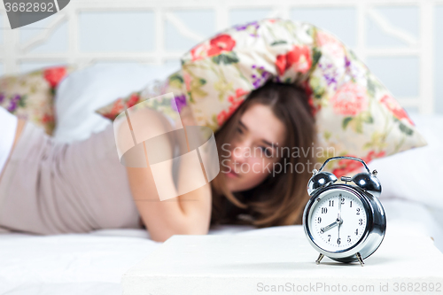 Image of The young girl in bed