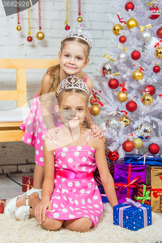 Image of Two girls at the beauty of Christmas trees