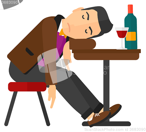 Image of Man sleeping in bar. 