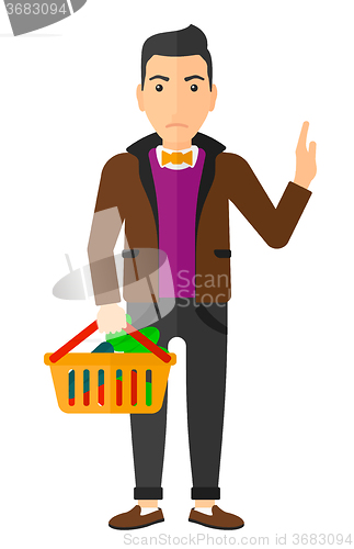 Image of Man holding supermarket basket.