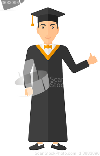 Image of Graduate showing thumb up sign.
