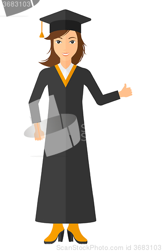 Image of Graduate showing thumb up sign.