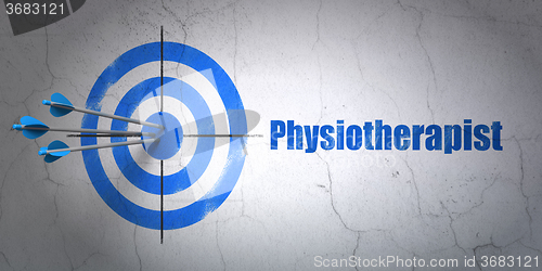 Image of Health concept: target and Physiotherapist on wall background