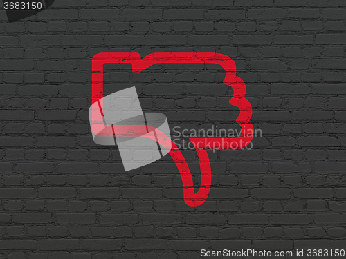 Image of Social media concept: Thumb Down on wall background