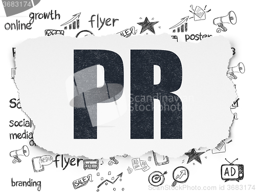 Image of Advertising concept: PR on Torn Paper background