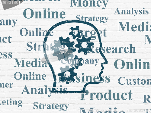 Image of Marketing concept: Head With Gears on wall background