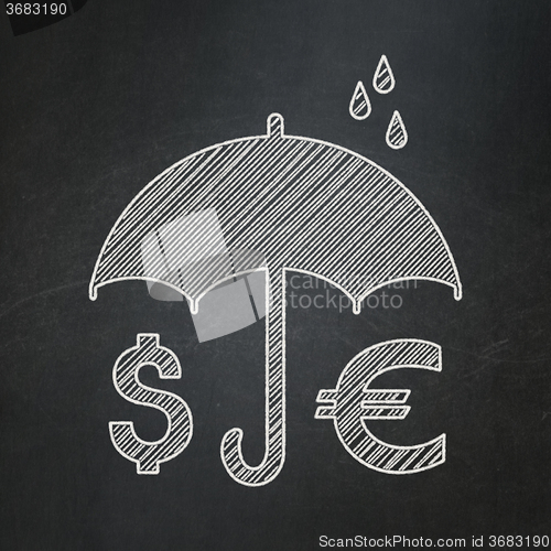 Image of Security concept: Money And Umbrella on chalkboard background