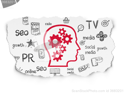 Image of Marketing concept: Head With Gears on Torn Paper background