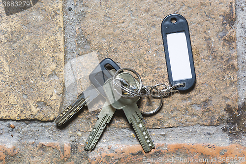 Image of plastic keychain on the floor