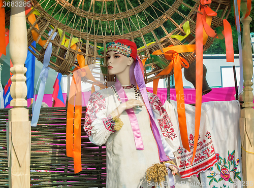 Image of The ancient national dress and a hat on the dummy.