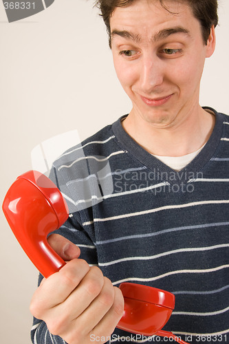 Image of red telephone receiver