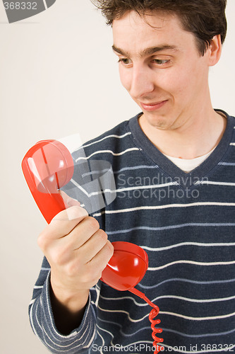 Image of red telephone receiver