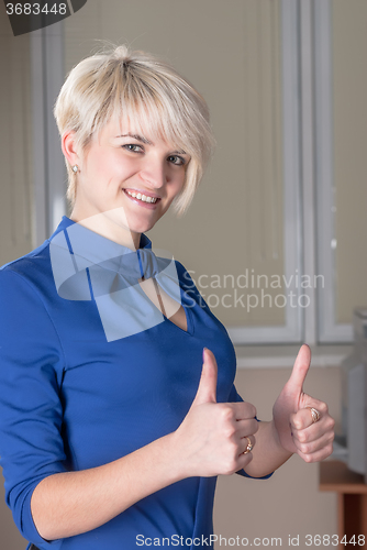 Image of Attractive business lady with thumb up gesture