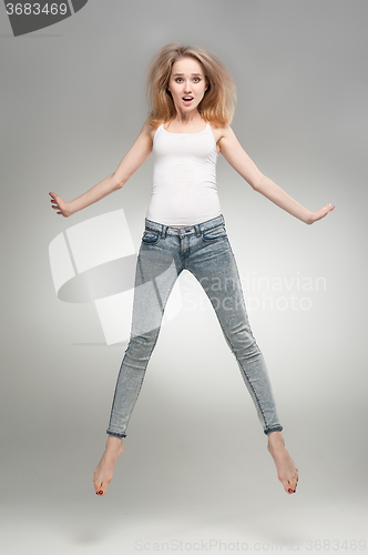 Image of Beautiful flying girl with surprise emotion