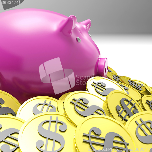 Image of Piggybank Surrounded In Coins Showing American Wealth