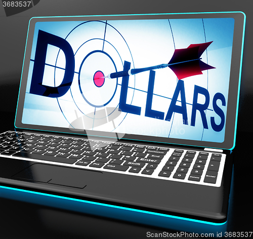 Image of Dollars On Laptop Shows Financial Currencies