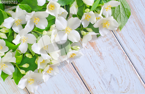 Image of jasmine spring flowers frame on white background