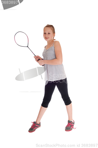 Image of Young blond girl with her tennis racquet.