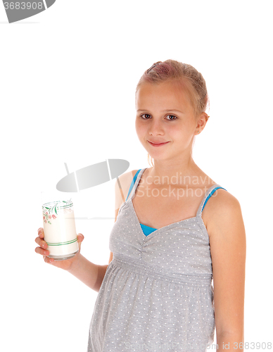 Image of Girl holding a glass of milk.