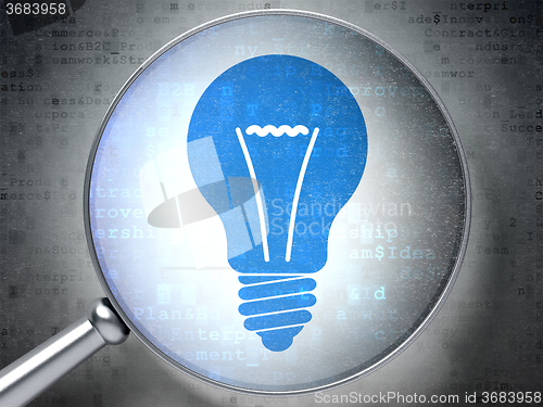 Image of Business concept: Light Bulb with optical glass on digital background