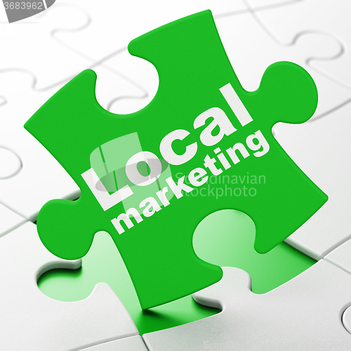 Image of Advertising concept: Local Marketing on puzzle background