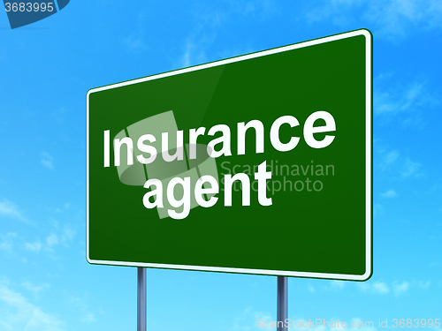 Image of Insurance concept: Insurance Agent on road sign background