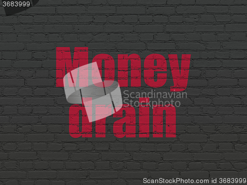 Image of Money concept: Money Drain on wall background