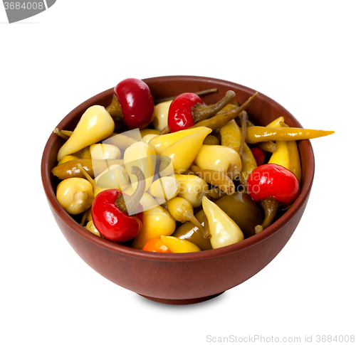 Image of Mix of hot turkish marinated peppers in ceramic bowl