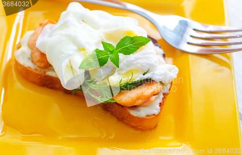Image of Close Up of Poached Delicious Egg with Whole Grain Bread