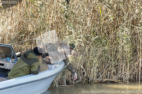 Image of Fisherman with tackle 