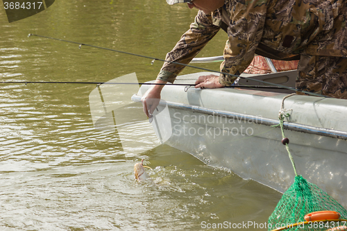 Image of Fisherman caught a catfish