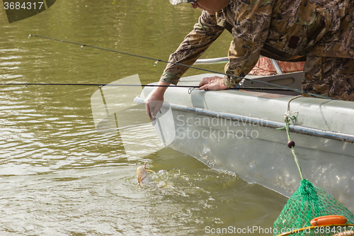 Image of Fisherman caught a catfish