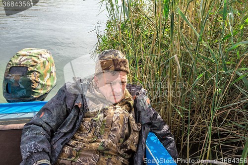 Image of Fisherman in boat  